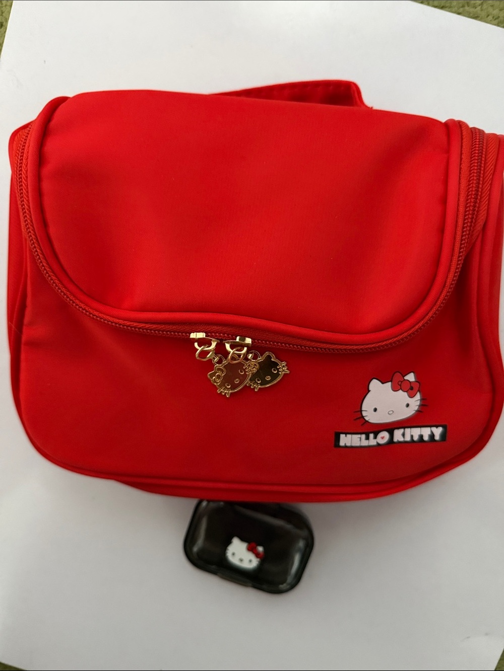 NWOT Hello Kitty Red Travel Pouch with Gold Charms.